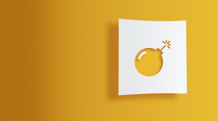 bomb on white information paper on yellow background